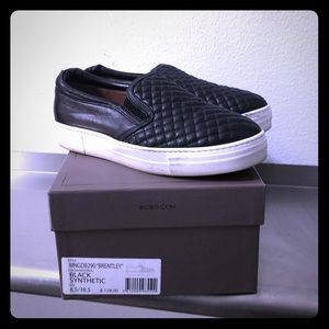 BCBGMAXAZRIA Black faux leather slip ons